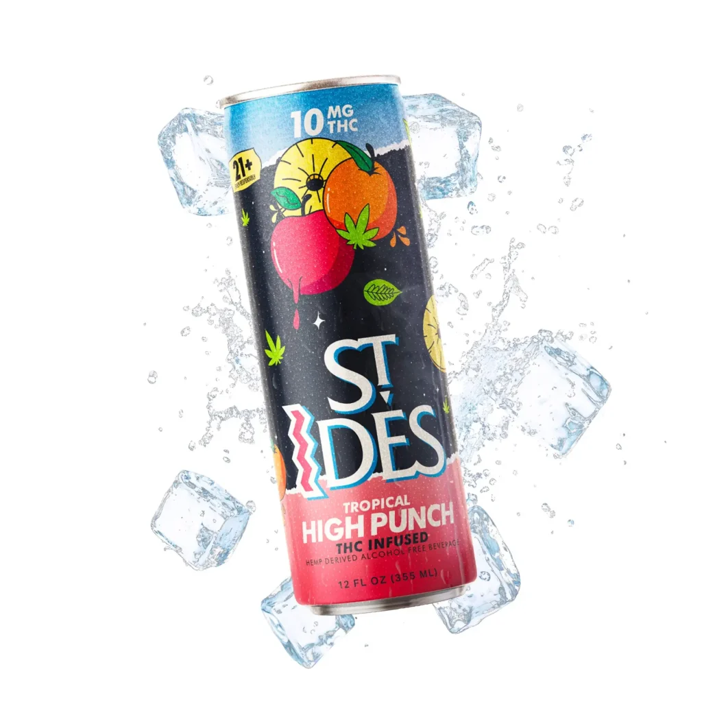 A cold bottle of St IDES High TEA Tropical Punch 10Mg THC resting inside an ice bucket next to fresh sliced tropical fruits